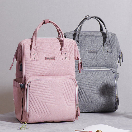 Sac à dos matelassé pour bébé avec fonction de sac à langer